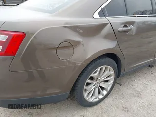 2015 Ford Taurus Limited with VIN 1FAHP2J84FG110702, listed as a IAAI auction lot 42060437 with 208,012 mi miles. Bid and sale history available at carsss.com. Image 6.