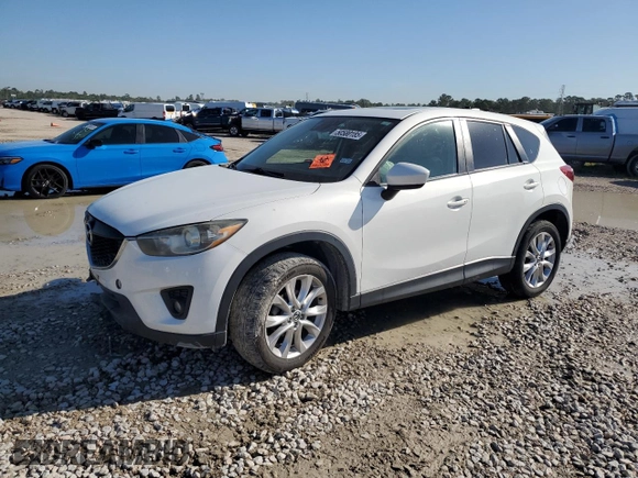 2015 Mazda CX-5 Grand Touring with VIN JM3KE2DY1F0453386, listed as a Copart auction lot 50580185 with 174,309 mi miles and Salvage Title. Bid and sale history available at carsss.com. Image 1.