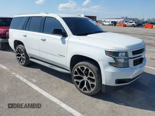 2015 Chevrolet Tahoe LT with VIN 1GNSCBKCXFR552071, listed as a IAAI auction lot 41972157 with 214,738 mi miles and . Bid and sale history available at DreamBid. Image 1.