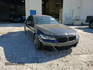 2023 BMW 5 Series M550i xDrive z VIN WBA13BK08PCM88687, wystawiony jako Copart lot #88633545 z przebiegiem Nie podano mil oraz Szkoda całkowita • Salvage title. Historia ofert i sprzedaży dostępna na DreamBid. Obrazek 11.