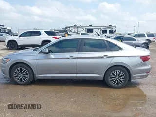 2021 Volkswagen Jetta S z VIN 3VWC57BU4MM094780, wystawiony jako IAAI lot #42103554 z przebiegiem 49 044 mil mil oraz . Historia ofert i sprzedaży dostępna na DreamBid. Obrazek 14.