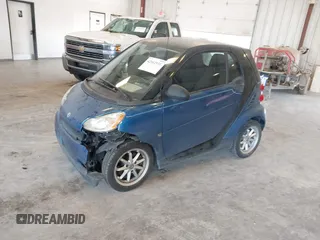 2009 Smart fortwo Pure with VIN WMEEJ31X89K228315, listed as a IAAI auction lot 42662931 with 60,666 mi miles and . Bid and sale history available at DreamBid. Image 2.