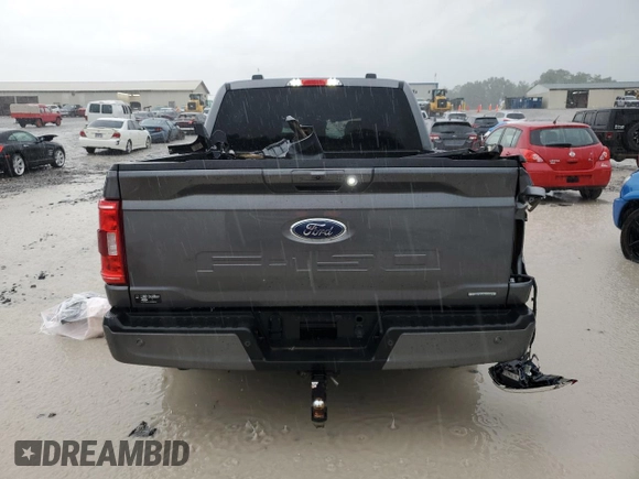 2023 Ford F-150 XL with VIN 1FTFW1E86PFA65505, listed as a Copart auction lot 60644385 with 6,959 mi miles and Salvage title. Bid and sale history available at DreamBid. Image 6.