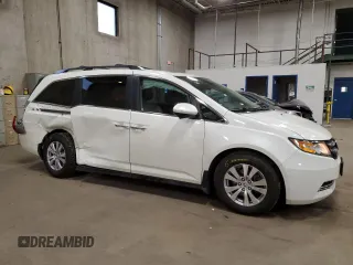 2016 Honda Odyssey EX-L with VIN 5FNRL5H67GB090747, listed as a Copart auction lot 53957235 with 131,464 mi miles and Salvage Title. Bid and sale history available at DreamBid. Image 4.