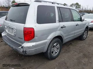 2003 Honda Pilot EX with VIN 2HKYF18413H554881, listed as a IAAI auction lot 41927719 with 999,999 mi miles. Bid and sale history available at carsss.com. Image 4.