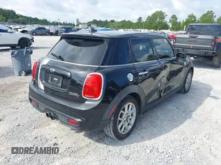 2016 MINI Hardtop 4 Door S z VIN WMWXU3C53G2D30807, wystawiony jako IAAI lot #42545577 z przebiegiem 86 952 mil mil oraz . Historia ofert i sprzedaży dostępna na DreamBid. Obrazek 4.
