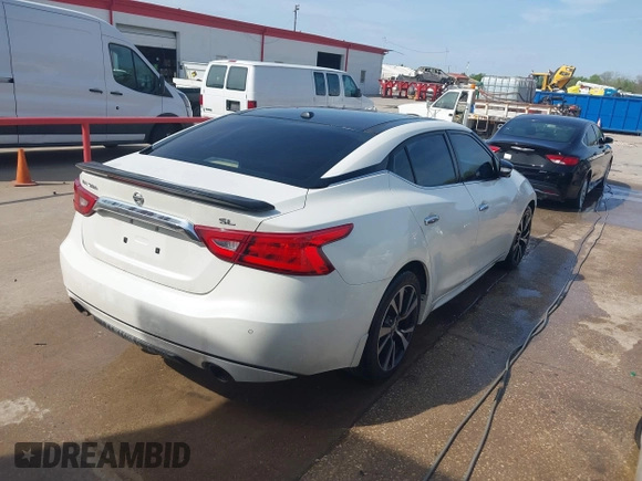 2016 Nissan Maxima SL with VIN 1N4AA6AP5GC383075, listed as a IAAI auction lot 41415505 with 164,392 mi miles and . Bid and sale history available at DreamBid. Image 4.