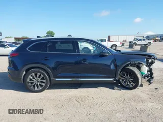 2016 Mazda CX-9 Grand Touring with VIN JM3TCADY6G0107064, listed as a IAAI auction lot 42580485 with 124,713 mi miles and . Bid and sale history available at DreamBid. Image 14.