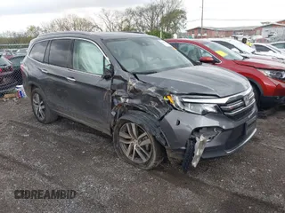2016 Honda Pilot Touring with VIN 5FNYF6H93GB003106, listed as a IAAI auction lot 41989772 with 110,123 mi miles. Bid and sale history available at carsss.com. Image 1.