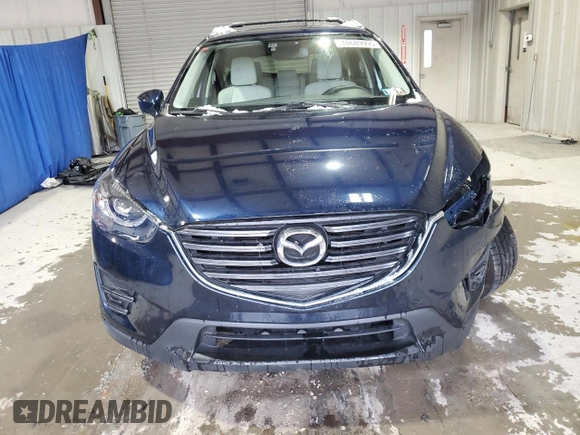 2016 Mazda CX-5 Grand Touring with VIN JM3KE4DY9G0708024, listed as a Copart auction lot 44689995 with 113,002 mi miles and Salvage Title. Bid and sale history available at DreamBid. Image 5.