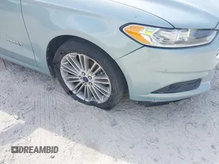2013 Ford Fusion SE Hybrid z VIN 3FA6P0LU8DR265460, wystawiony jako IAAI lot #42720385 z przebiegiem 146 179 mil mil oraz . Historia ofert i sprzedaży dostępna na DreamBid. Obrazek 6.