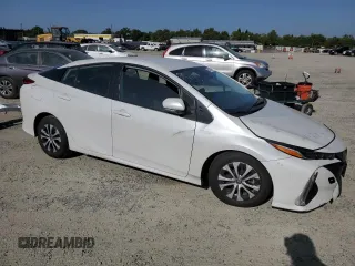 2021 Toyota Prius LE with VIN JTDKAMFP2M3173895, listed as a Copart auction lot 54384825 with 72,915 mi miles and Salvage Title. Bid and sale history available at DreamBid. Image 4.
