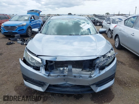 2018 Honda Civic LX with VIN 2HGFC2F50JH500559, listed as a IAAI auction lot 42040271 with 82,026 mi miles and . Bid and sale history available at DreamBid. Image 12.