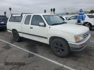 1995 Toyota T100 SR5 with VIN JT4VD12F8S0007489, listed as a Copart auction lot 82177794 with 290,145 mi miles and Clean Title. Bid and sale history available at DreamBid. Image 4.