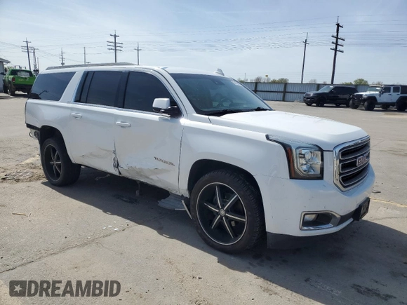 2016 GMC Yukon XL SLT with VIN 1GKS2GKC6GR228033, listed as a Copart auction lot 52450055 with 135,476 mi miles and Salvage Title. Bid and sale history available at DreamBid. Image 4.