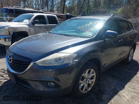 2015 Mazda CX-9 Touring with VIN JM3TB3CV1F0461854, listed as a IAAI auction lot 42068299 with 128,124 mi miles. Bid and sale history available at carsss.com. Image 2.