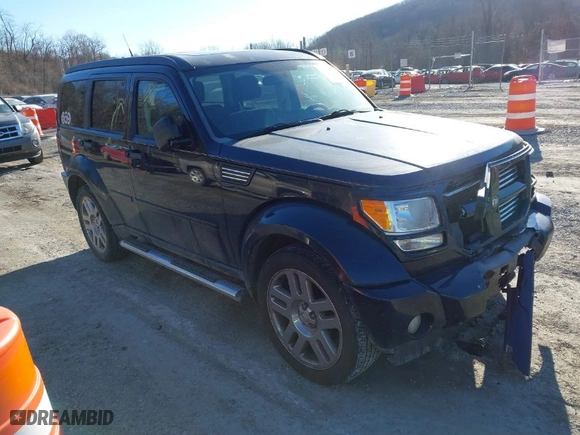 2011 Dodge Nitro Heat with VIN 1D4PU4GK1BW522673, listed as a IAAI auction lot 41448169 with 174,827 mi miles. Bid and sale history available at carsss.com. Image 1.