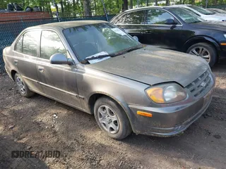 2005 Hyundai Accent GLS z VIN KMHCG45C65U607423, wystawiony jako IAAI lot #42142929 z przebiegiem 181 516 mil mil oraz . Historia ofert i sprzedaży dostępna na DreamBid. Obrazek 1.