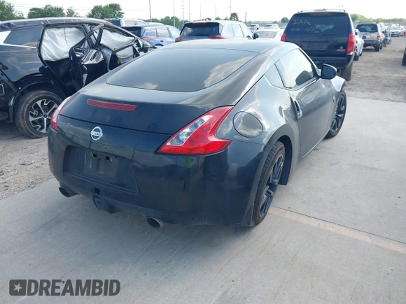 2015 Nissan 370Z z VIN JN1AZ4EH2FM442556, wystawiony jako IAAI lot #41956287 z przebiegiem 128 769 mil mil oraz . Historia ofert i sprzedaży dostępna na DreamBid. Obrazek 4.