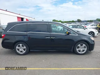 2012 Honda Odyssey Touring with VIN 5FNRL5H93CB121190, listed as a IAAI auction lot 42223998 with 154,358 mi miles and . Bid and sale history available at DreamBid. Image 13.