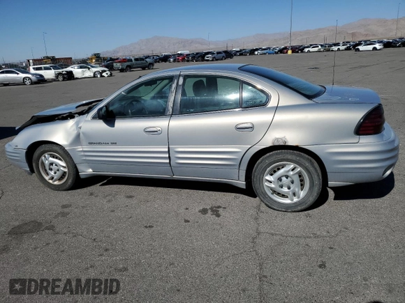 1999 Pontiac Grand Am SE2 with VIN 1G2NE52E5XM826878, listed as a Copart auction lot 77351164 with 241,463 mi miles and Salvage Title. Bid and sale history available at carsss.com. Image 2.