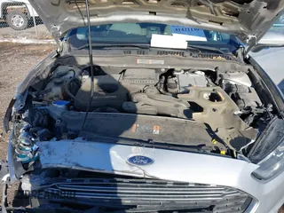 2015 Ford Fusion S Hybrid with VIN 3FA6P0UU7FR307568, listed as a IAAI auction lot 41421139 with 152,186 mi miles. Bid and sale history available at carsss.com. Image 10.