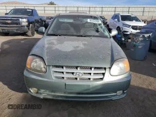 2003 Hyundai Accent GL with VIN KMHCG35CX3U242848, listed as a Copart auction lot 86558394 with 56,248 mi miles and Salvage Title. Bid and sale history available at carsss.com. Image 5.