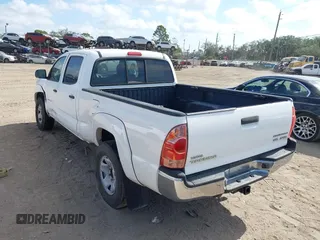 2005 Toyota Tacoma PreRunner with VIN 3TMKU72N65M001821, listed as a IAAI auction lot 41579911 with 301,297 mi miles. Bid and sale history available at carsss.com. Image 3.