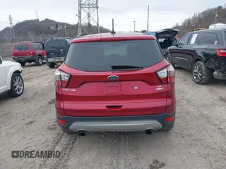 2018 Ford Escape SE z VIN 1FMCU9GD6JUA18684, wystawiony jako IAAI lot #41499540 z przebiegiem 105 127 mil mil oraz . Historia ofert i sprzedaży dostępna na DreamBid. Obrazek 16.