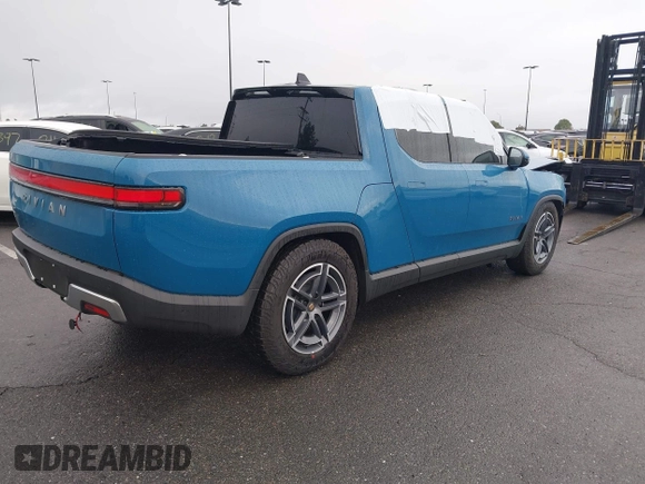 2025 Rivian R1T Adventure z VIN 7FCTGBAA9SN035986, wystawiony jako IAAI lot #41510257 z przebiegiem 2 102 mil mil oraz . Historia ofert i sprzedaży dostępna na DreamBid. Obrazek 4.