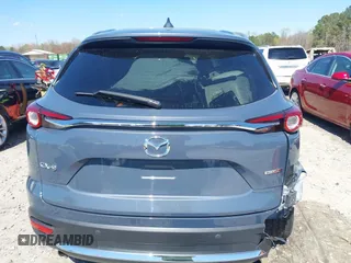 2021 Mazda CX-9 Carbon Edition with VIN JM3TCADY9M0517174, listed as a IAAI auction lot 41871485 with 48,484 mi miles and . Bid and sale history available at DreamBid. Image 17.