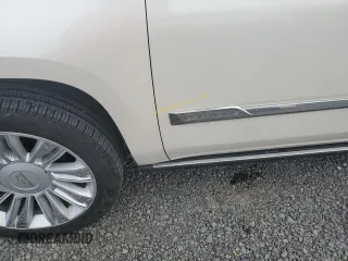 2015 Cadillac Escalade Platinum z VIN 1GYS4PKJ5FR574930, wystawiony jako Copart lot #74691204 z przebiegiem Nie podano mil oraz Szkoda całkowita • Salvage title. Historia ofert i sprzedaży dostępna na DreamBid. Obrazek 12.