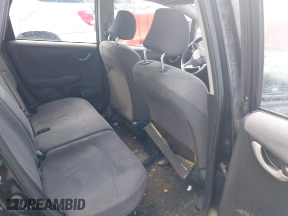 2009 Honda Fit with VIN JHMGE88249S053398, listed as a IAAI auction lot 42818376 with 242,218 mi miles and . Bid and sale history available at DreamBid. Image 8.