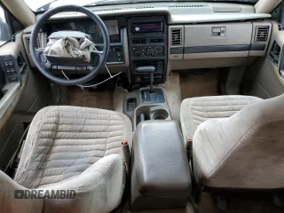 1995 Jeep Grand Cherokee Laredo with VIN 1J4FX58S8SC773884, listed as a Copart auction lot 56572555 with 424,126 mi miles and Salvage title. Bid and sale history available at DreamBid. Image 8.