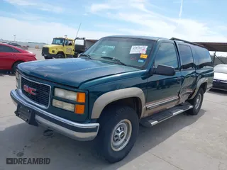 1998 GMC Suburban with VIN 1GKGK26J4WJ734958, listed as a IAAI auction lot 41878070 with 131,528 mi miles. Bid and sale history available at carsss.com. Image 18.