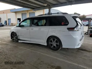 2012 Toyota Sienna SE with VIN 5TDXK3DC9CS215991, listed as a Copart auction lot 51868005 with 215,075 mi miles and Salvage title. Bid and sale history available at DreamBid. Image 2.