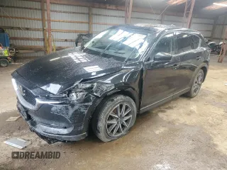 2018 Mazda CX-5 Grand Touring z VIN JM3KFBDM9J0450593, wystawiony jako Copart lot #57959835 z przebiegiem 197 616 mil mil oraz Tytuł czysty. Historia ofert i sprzedaży dostępna na DreamBid. Obrazek 1.