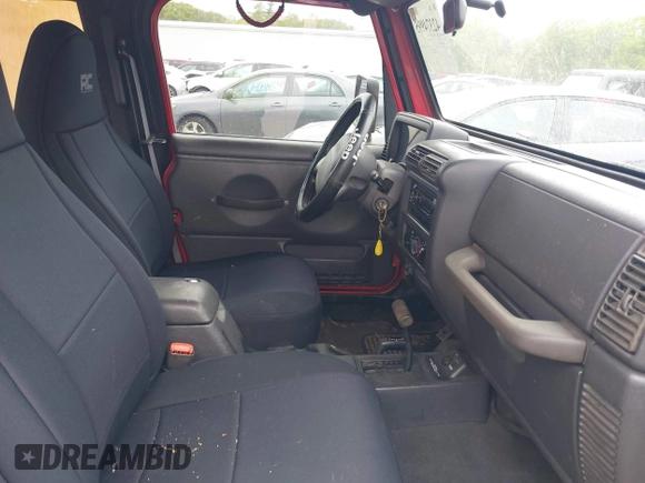 1999 Jeep Wrangler Sport z VIN 1J4FY19S0XP482218, wystawiony jako IAAI lot #42374995 z przebiegiem 149 216 mil mil oraz . Historia ofert i sprzedaży dostępna na DreamBid. Obrazek 5.