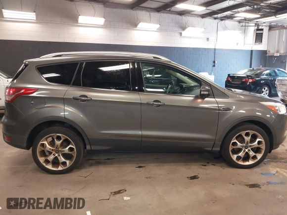 2014 Ford Escape Titanium with VIN 1FMCU9JX0EUE45254, listed as a IAAI auction lot 42038700 with 60,103 mi miles. Bid and sale history available at carsss.com. Image 13.