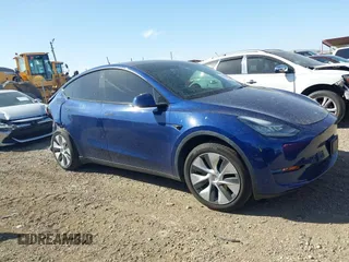 2021 Tesla Model Y Standard Range z VIN 5YJYGDED6MF107711, wystawiony jako IAAI lot #41794384 z przebiegiem 86 934 mil mil oraz . Historia ofert i sprzedaży dostępna na DreamBid. Obrazek 13.
