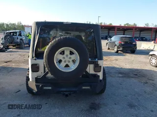 2005 Jeep Wrangler Unlimited with VIN 1J4FA44S65P335444, listed as a IAAI auction lot 41731093 with 143,918 mi miles. Bid and sale history available at carsss.com. Image 16.