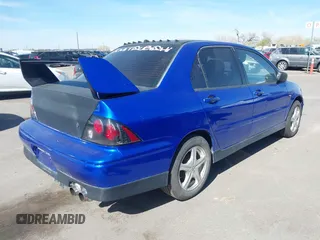 2002 Mitsubishi Lancer OZ-Rally with VIN JA3AJ86E82U068706, listed as a IAAI auction lot 41820754 with 133,843 mi miles. Bid and sale history available at carsss.com. Image 4.