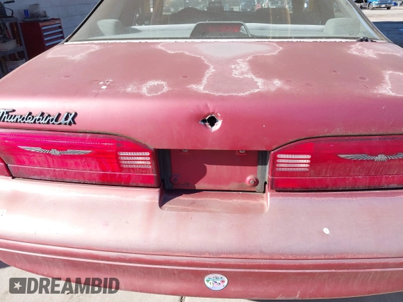 1997 Ford Thunderbird LX with VIN 1FALP6247VH138208, listed as a IAAI auction lot 41562980 with 135,204 mi miles and . Bid and sale history available at DreamBid. Image 6.