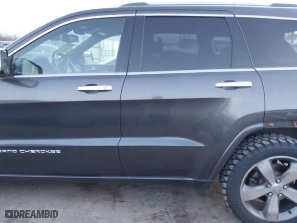 2014 Jeep Grand Cherokee Overland with VIN 1C4RJFCT8EC380899, listed as a IAAI auction lot 41372034 with 140,413 mi miles. Bid and sale history available at carsss.com. Image 15.