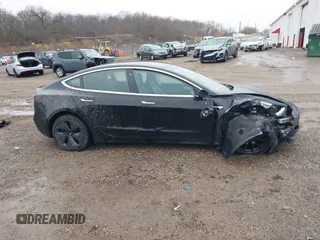 2018 Tesla Model 3 Long Range Battery with VIN 5YJ3E1EB1JF127289, listed as a IAAI auction lot 41484253 with 60,577 mi miles and . Bid and sale history available at DreamBid. Image 13.