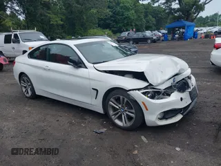 2015 BMW 4 Series 428i xDrive z VIN WBA3N9C56FK246359, wystawiony jako IAAI lot #39911529 z przebiegiem 137 494 mil mil oraz . Historia ofert i sprzedaży dostępna na DreamBid. Obrazek 1.