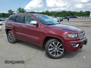 2017 Jeep Grand Cherokee Overland with VIN 1C4RJFCG5HC874130, listed as a Copart auction lot 65324695 with 101,588 mi miles and Salvage title. Bid and sale history available at DreamBid. Image 4.