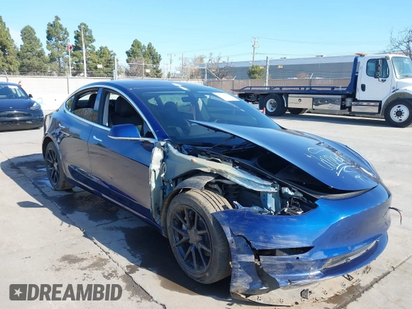 2018 Tesla Model 3 Long Range Battery with VIN 5YJ3E1EA4JF011799, listed as a IAAI auction lot 41765860 with 133,098 mi miles. Bid and sale history available at carsss.com. Image 6.