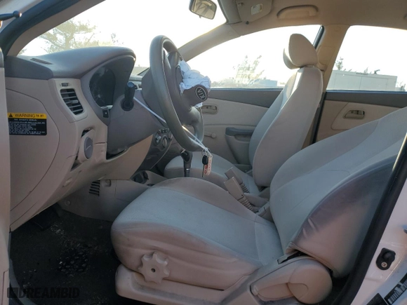 2010 Kia Rio LX with VIN KNADH4A3XA6624135, listed as a Copart auction lot 45455745 with 143,623 mi miles and Salvage Title. Bid and sale history available at carsss.com. Image 7.
