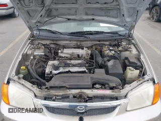 2000 Mazda Protege DX with VIN JM1BJ2227Y0237323, listed as a IAAI auction lot 42179683 with Not Provided miles and . Bid and sale history available at DreamBid. Image 10.